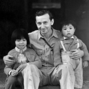 Eugene Wozniak, a combat photographer who served in the CBI, as part of the 491st Bomb Squadron, with two Chinese children during WWII.