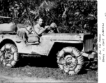 Lt. Col. Charles E. Mason on a muddy jeep, and ready to move forward, in the CBI during WWII.