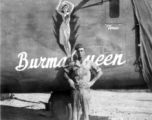 A US serviceman standing before the B-24 "Burma Queen" in the CBI.