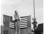 Pat O'Brien's USO troupe performs at an American airbase in China in October 1944--Here  Pat O'Brien perform at the microphone.