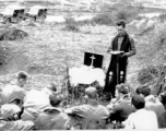 Retreat during Ichigo: "This is Captain Kelley our group chaplain holding roadside services for a group of G.I.'s during the evacuation of our base at Kwelin (Guilin) China."