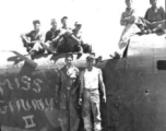 "Here is a crew from the 396th doing some salvage work on the B-24 Miss Ginny.The two guys standing are Dowds on left and Kriewitz on the right. Sitting on plane far left are Rizzo and Gerdsen. On the far right are Mayfield and Blaske. Nothing went to waste in China."
