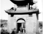 An American GI poses in a gateway at Yunnanyi, China, during WWII, in 1944.