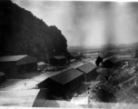 "Our First Home In China--This is a picture of our engineering area at Kwelin [Guilin],China. This was our first stop after leaving Kunming in January 1944. We had crews on detached service on bases at Hengyang, Chickiang, Chanyi, Ankang, Luichow, Nanning and Tanchuck. We were proud of the work performed at Kwelin. We built eight P-40's from the scrap-yard and turned them over to the line outfits to be returned to action." Caption courtesy of Elmer Bukey.