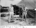 Lt. James C. Spaulding and T/Sgt Silvio C. Merlin pose in front of the "Local Issue" tent in India.    From the collection of David Firman, 61st Air Service Group.