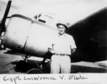 Capt. Lawrence V. Blade poses before an airplane during WWII.   From the collection of David Firman, 61st Air Service Group.
