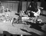 Wares laid out by a roadside hardware vendor in China during WWII.