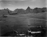 Photos taken by Robert F. Riese in or around Liuzhou city, Guangxi province, China, in 1945.  Aerial view adjacent to the American base at Liuzhou. Notice the shadow the airplane in the foreground.