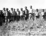 "A collection of children from several villages south of Yangkai picked up on a hike. Taking their picture was one way of having them go home.  Just before Nash & the mounds, Spring 1945."  From the collection of Frank Bates.