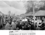 "Village scene in Mengsa or Szemao" in SW China, in 1944, during WWII. Likely market day activities.