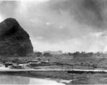 Tents for GIs at the American base at Liuzhou during WWII. Not the man fishing in the lower right, and the volleyball court right below the tents in the middle.