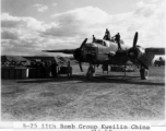 Maintenance personnel move across upper surfaces during pre-mission servicing of a B-25H 'gunship' of the 11th Bomb Squadron (not Group), 341st Bomb Group at Yang Tong Airfield, Guilin in Guangxi province, China. Circa fall of 1944.