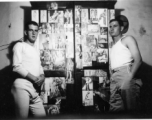 View inside barracks for two GIs in Yunnan, China, during WWII--here a wardrobe covered in pin-up girls.