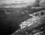American planes bomb Japanese military shipping in occupied Hong Kong harbor, during WWII.