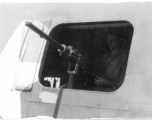 Gunner at waist gun of B-24 in the CBI during WWII.