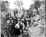 American liaison officers and Chinese troop commanders plan coordinated air and ground attack on Japanese forces at Hung Chiu Hill, southwest of Chefang.  L-R: Capt. Benjamin C. Adams, Earl M. Rothberger, Capt. William L. Yeomans (F. A. Liaison O), Col. Wang Ching-shan (C.O. 389th Reg.), Lt. Col. J.N. Ruggieri (Liaison O. With 130th Division), Wang Chen-yuan (Interpreter), and Maj. Gen. Wang Li-huan (C.G. 130th Div., 53rd Chinese Army).  Yunnan Province on November 30, 1944.   Photo by T/5 W. E. Shemorry. B