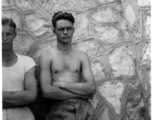 GIs of the 7th Bombardment Group leaning against a rock wall in China, during WWII, August 15, 1942.  Left is A. L. Cogwell, right is C. M. DeLeeuw.