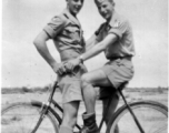 Two flyers goof on a bicycle in the CBI during WWII. Stanley Mamlock on the right.