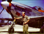 Flyer posing before P-51 "Josephine" in China.  During WWII.