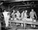 GIs of the 797th Engineer Forestry Company in Burma, getting chow.  During WWII.