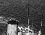 Near miss on a Japanese freighter, with white-suited Japanese sailors scrambling about the deck. From an October 16, 1944, mission on Hong Kong, 491st Bomb Squadron.