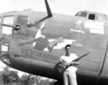 Pilot Edward "Two-Gun" McCoy posing with M1903 "Springfield" rifle in 1943 before his plane, B-24 WE'REWOLVES. His stance matches the image of him painted by Thomas Grady near the pilot's window, above him.  (Thanks to John Olin for supplemental info about his grandfather "Two-Gun" McCoy!)