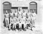 24th Mapping Squadron C.O. and staff pose for a group shot. (December 1944-May 1945.)  Rear: Lt. Key, Capt. Smith, Lt. Walters, Capt. Rebers, Capt. Geiger, Lt. Kunn, Lt. Maddox.  Front: Capt. Hiendell, Major Hubers, Lt. Col. King, Capt. Bagshaw.  Image originally from Charles A. Runyon.