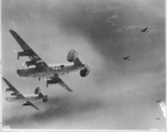 B-24s bombing Sinshih, 8.6.1944.  Consolidated B-24J-25-CO Liberator "Burma Queen" (308th BG 425th BS; #42-73253).  Consolidated B-24J-35-CO Liberator "Krachy Kourier" (308th BG 425th BS; #42-73318).