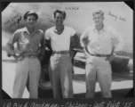 Three flyers pose with B-24 in Burma during 1943.  "Hot Shot CHARLIE," "SNARE," and "Tenny-Lee."  Left to right: Bud Goodman (Chicago), Ned Levey, Ray Henderson (North Carolina).