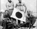 GIs show off trophy captured Japanese Good-Luck Flag  (寄せ書き日の丸) collected on the battleground in the CBI during WWII.