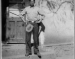"'Giggles,' our houseboy in Yunnanyi." (Yunnan, China). During WWII.