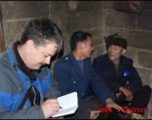 Images from January 14, 2008 visit to a WWII US crash site at Bamo township, in Tian\'e county, Guangxi province.     Patrick LUCAS interviewing elders in the village.  Mr. MA, 95 years old, in this picture,  was taking part in a family wedding on the day we visited, but was gracious to talk with us anyway.