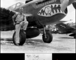 Lt. Col Richard Triber standing before the P-40 "Little Richard."