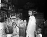 Kids in a small retail shop in China during WWII.    From the collection of David Firman, 61st Air Service Group.