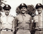 Walter G. Daniels and two of his fellow officers pose in uniform with smiles all around. During WWII.