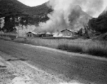 Al's notation is "Burning everything before evacuation." American hostels at the base burn during the American and Chinese retreat before the Japanese arrive in the fall of 1944.  Guangxi province, Liuzhou air base.
