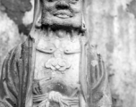 A weathered Buddhist figurine in China during WWII.