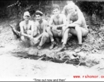 "Time out now and then"  The boys roasting meat over a fire pit.  Rex G. Gouger is on the far right.