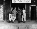 American GIs and Chinese man stand in front of a photo shop, the Wen Hwa Studio (文化摄影社), in China during WWII.