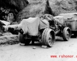 Chinese heavy gun by the side of the road in southwest China, during WWII.  Notice the rigid wheels--rubber was in short supply during wartime.