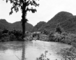 Scenery, including a canal or other water work, in southwest China, either Guangxi or Guizhou province, during WWII.
