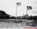 "Liuchow (Liuzhou)--retaken, first flag raising."  I In 1945, Chinese and Americans salute as two flags are raised in Liuzhou airbase, Guangxi province, China, during WWII.