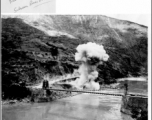 Detonating Japanese dud bomb from raid of August 23, 1944, at the Salween River Bridge.  Photo from Raimon B. Cary.