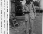 Bill Fowler with a monkey on his back, during WWII.