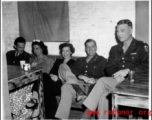 Officers and ladies relax in the CBI during WWII, during a party and dance at the Hostel #10 Officer's Club on January 19, 1945.
