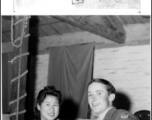 A very young GI enthusiastically talks to a beautiful Chinese woman at a party and dance at the Hostel #10 Officer's Club, Kunming, on January 19, 1945.