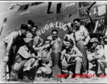 Flyers admire bomb in front of B-24 "Chug-A-Lug" during WWII.  Photo from Emery and Beth Vrana.