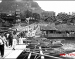 Floating boat-bridge, Floating "boat-bridge, looking towards our side of Luichow, China Sept 1944."  Horse-Saddle mountain (马鞍山) in the background. towards our side of Luichow, China Sept 1944.  From the collection of Frank Bates.