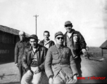 Three US servicemen with a local civilian and with a Chinese soldier, most likely in Yangkai, Yunnan, China.  Walter is sitting on the left in the front.