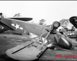 A small aircraft, a Stinson L-5 Sentinel, tail number #416889, flipped over after a tornado on the flight line at Shamsernasar, Assam. A C-64, tail number #35302, is tipped into a ditch behind it. (Thanks to jbarbaud for additional information!)   From the collection of David Firman, 61st Air Service Group.